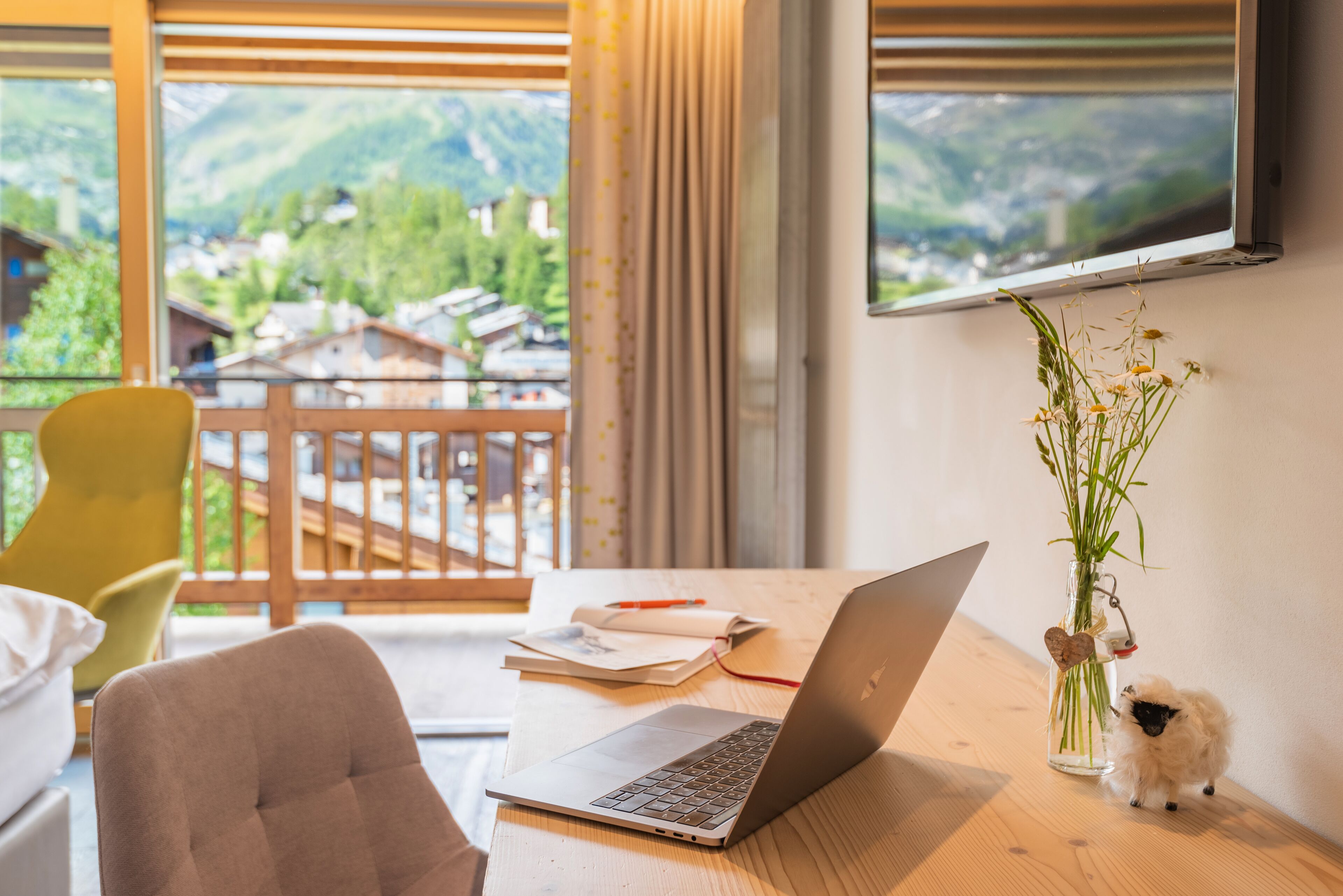 design double room, mountain view | living area | flat-screen tv