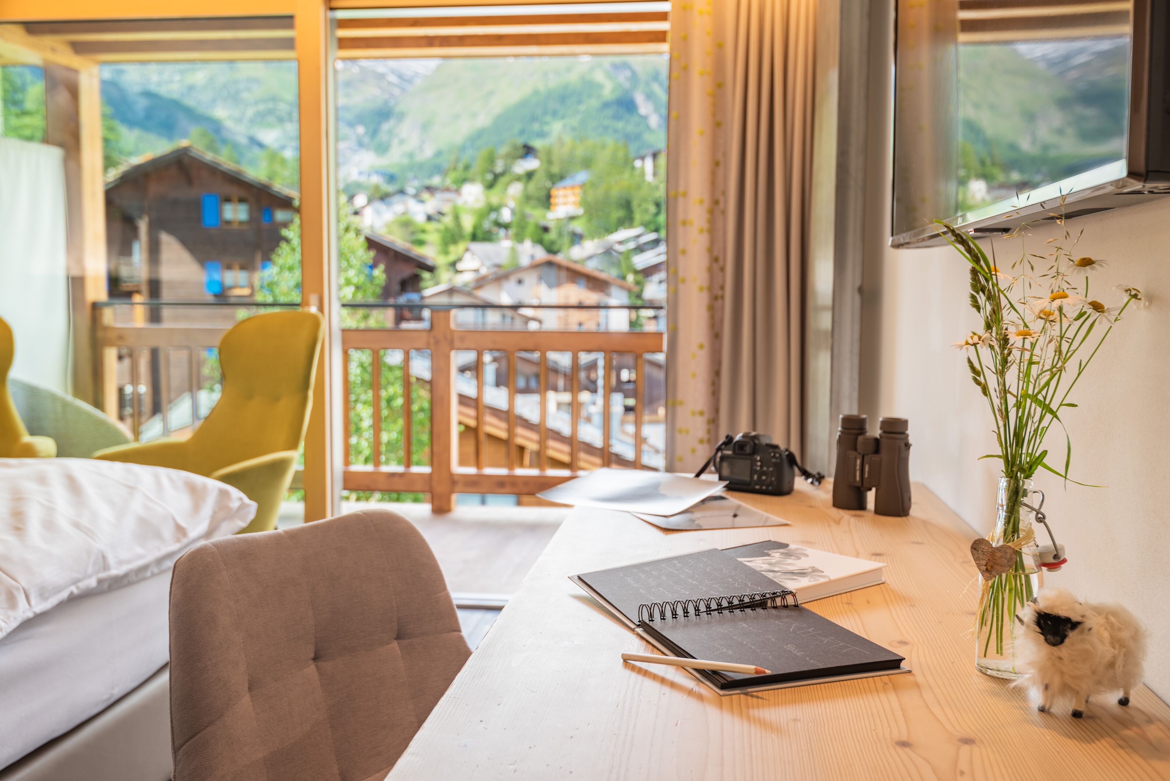 design double room, mountain view | living area | flat-screen tv