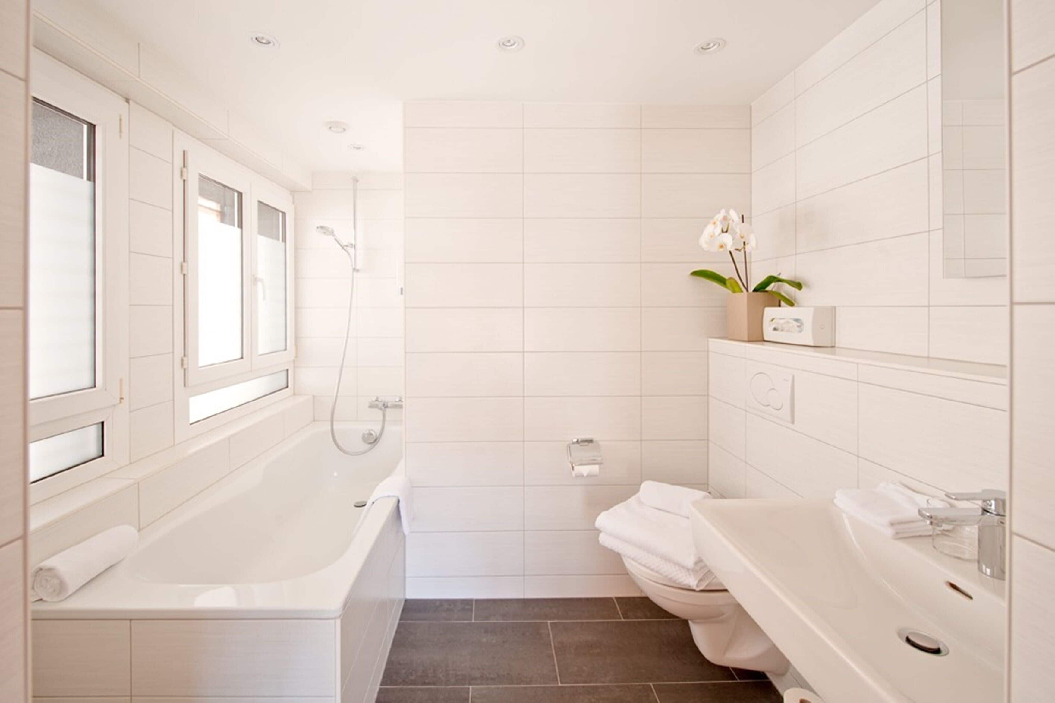 small queenbed room with mountain view (matterhorn) | bathroom | hair dryer, bathrobes, towels