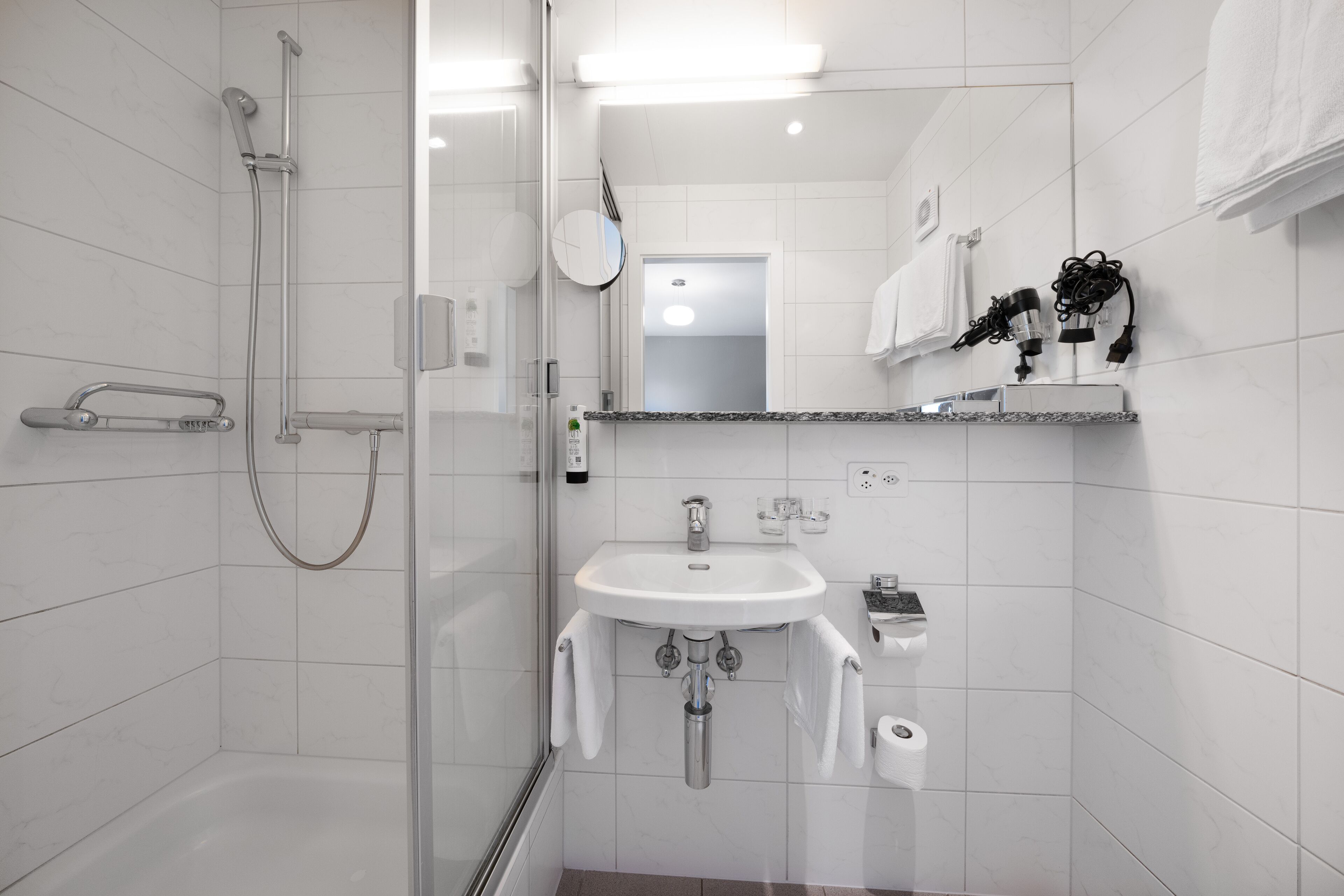 cozy double room | bathroom | hair dryer, towels