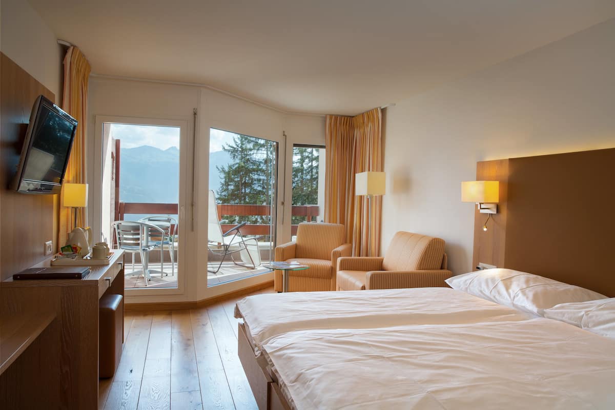 superior double room, balcony, mountain view | minibar, in-room safe, desk, blackout curtains