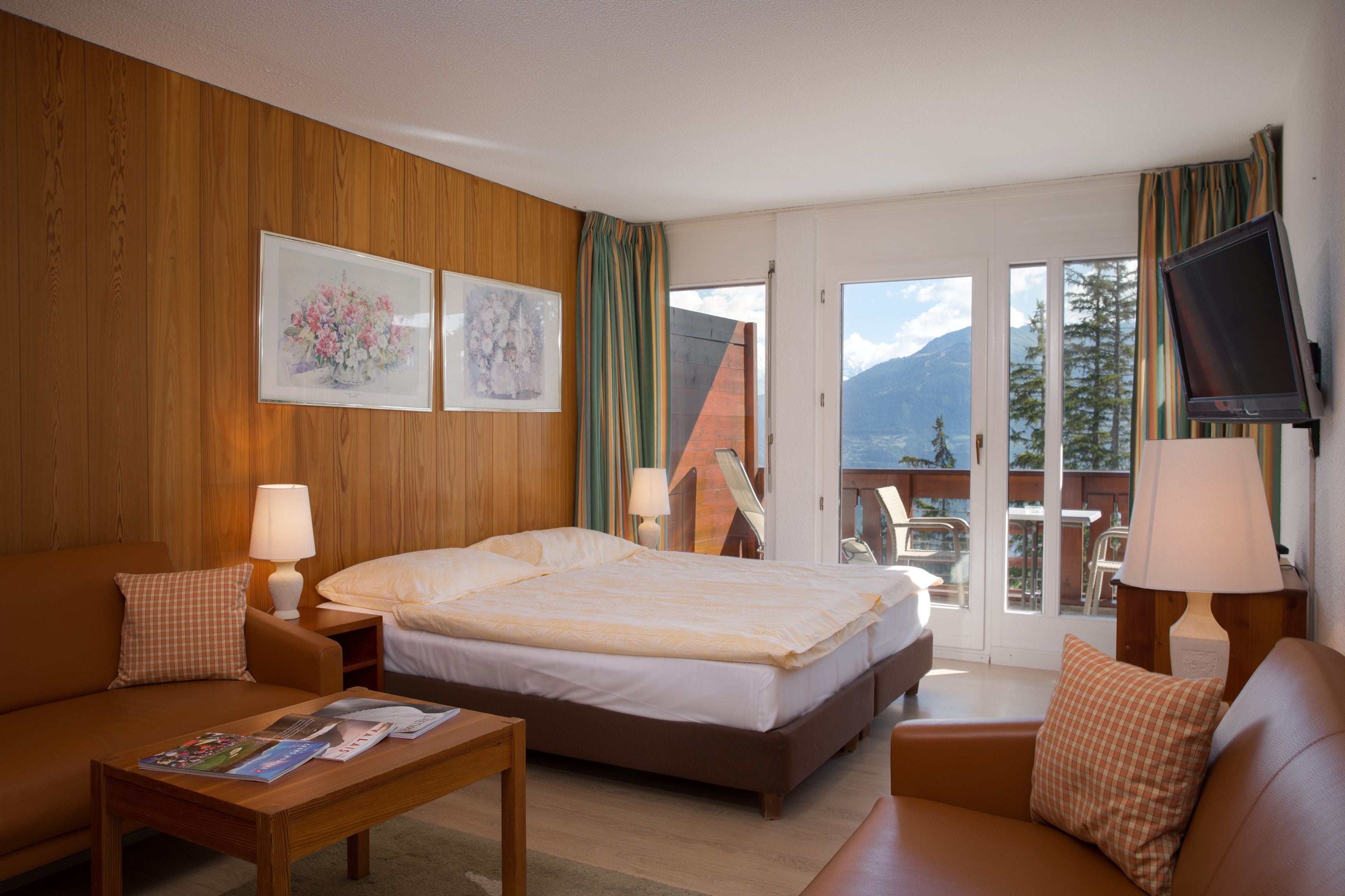 superior double room, balcony, mountain view | minibar, in-room safe, desk, blackout curtains