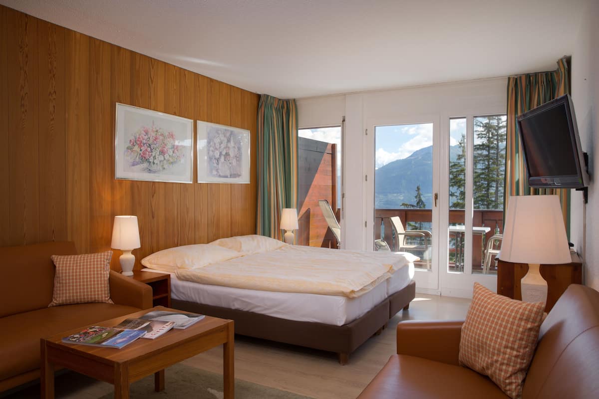 superior double room, balcony, mountain view | minibar, in-room safe, desk, blackout curtains