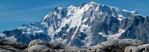 A rugged mountain with snow-covered peaks and rocky foreground. - Wellness spa Pirmin Zurbriggen (Saas Almagell)