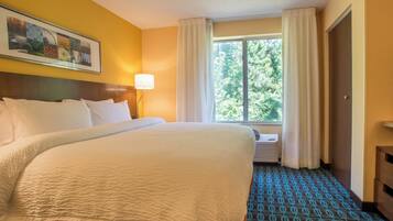 Premium bedding, desk, laptop workspace, iron/ironing board