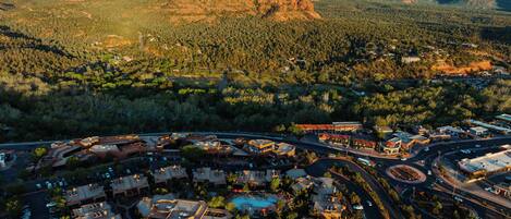A resort with multiple buildings, a parking area, and a road network.