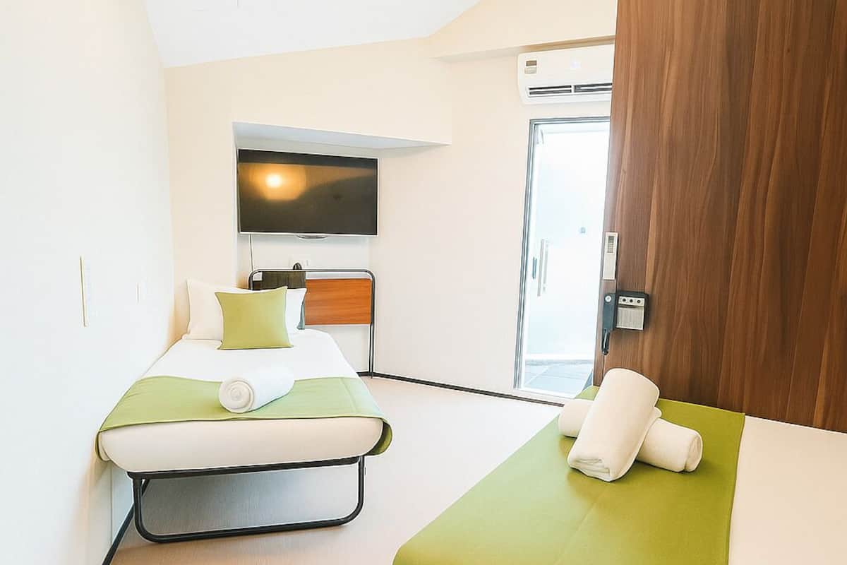 Family Suite With Patio | 1 bedroom, free WiFi, bed sheets