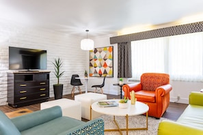 Executive Suite, 1 Bedroom | Living area | 40-inch LCD TV with cable channels, TV