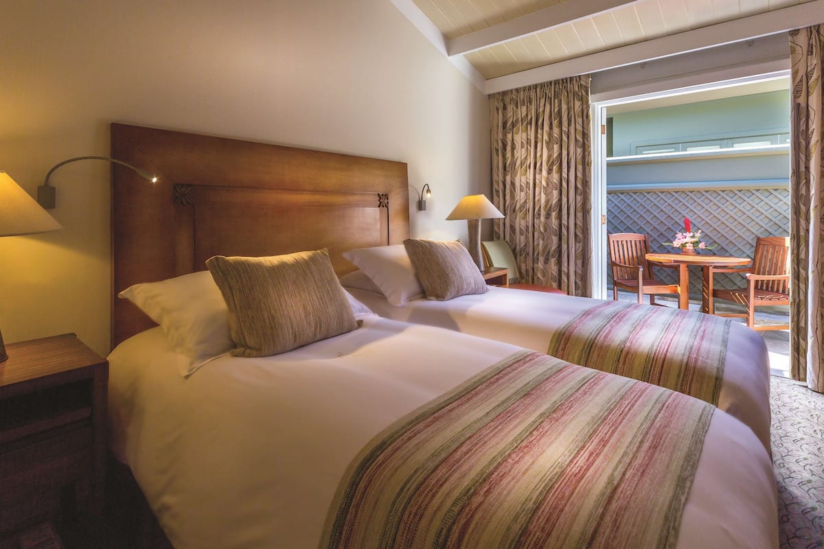 Standard Room, Patio | 1 bedroom, hypo-allergenic bedding, down comforters, free minibar