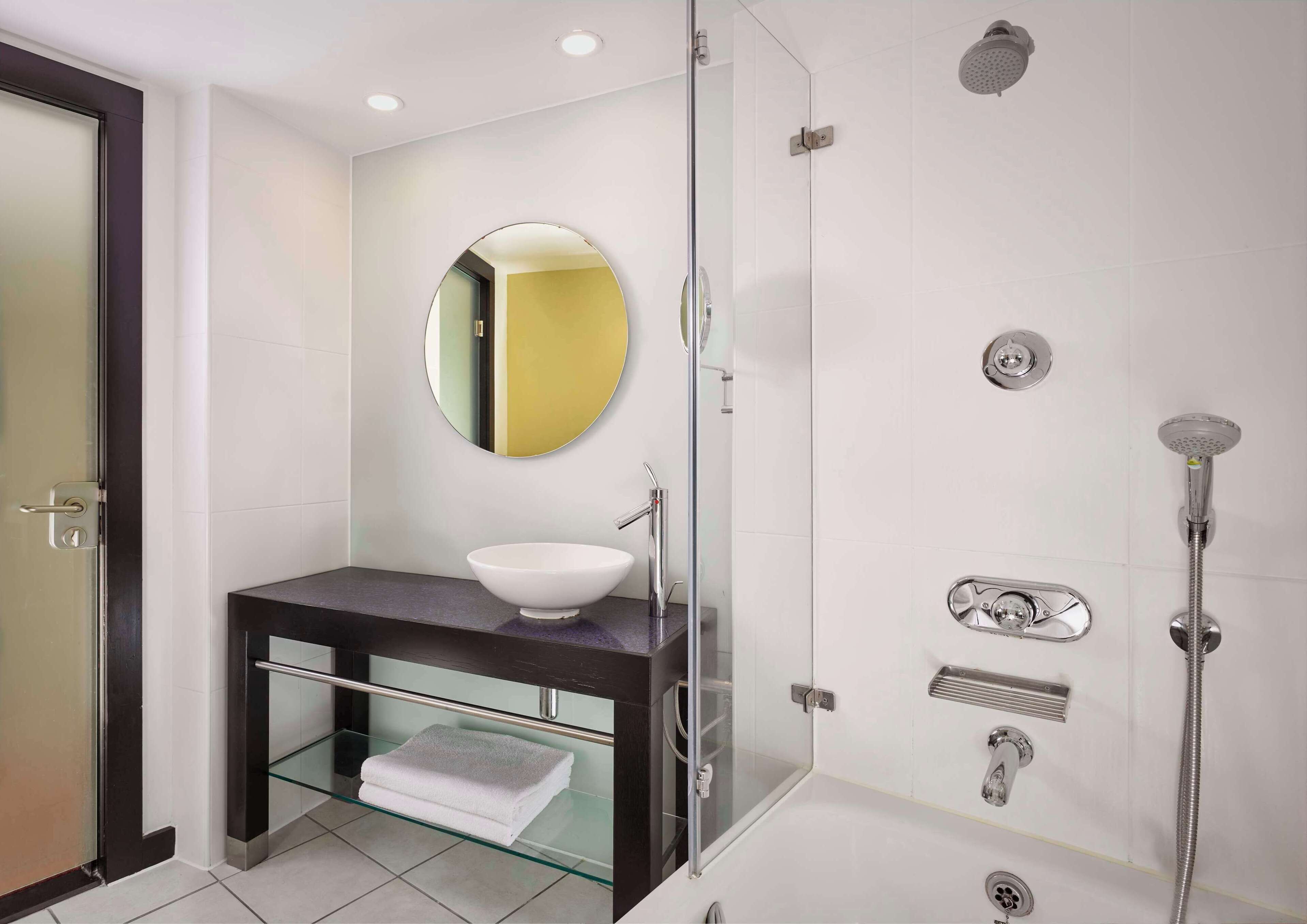 shower, designer toiletries, hair dryer, towels