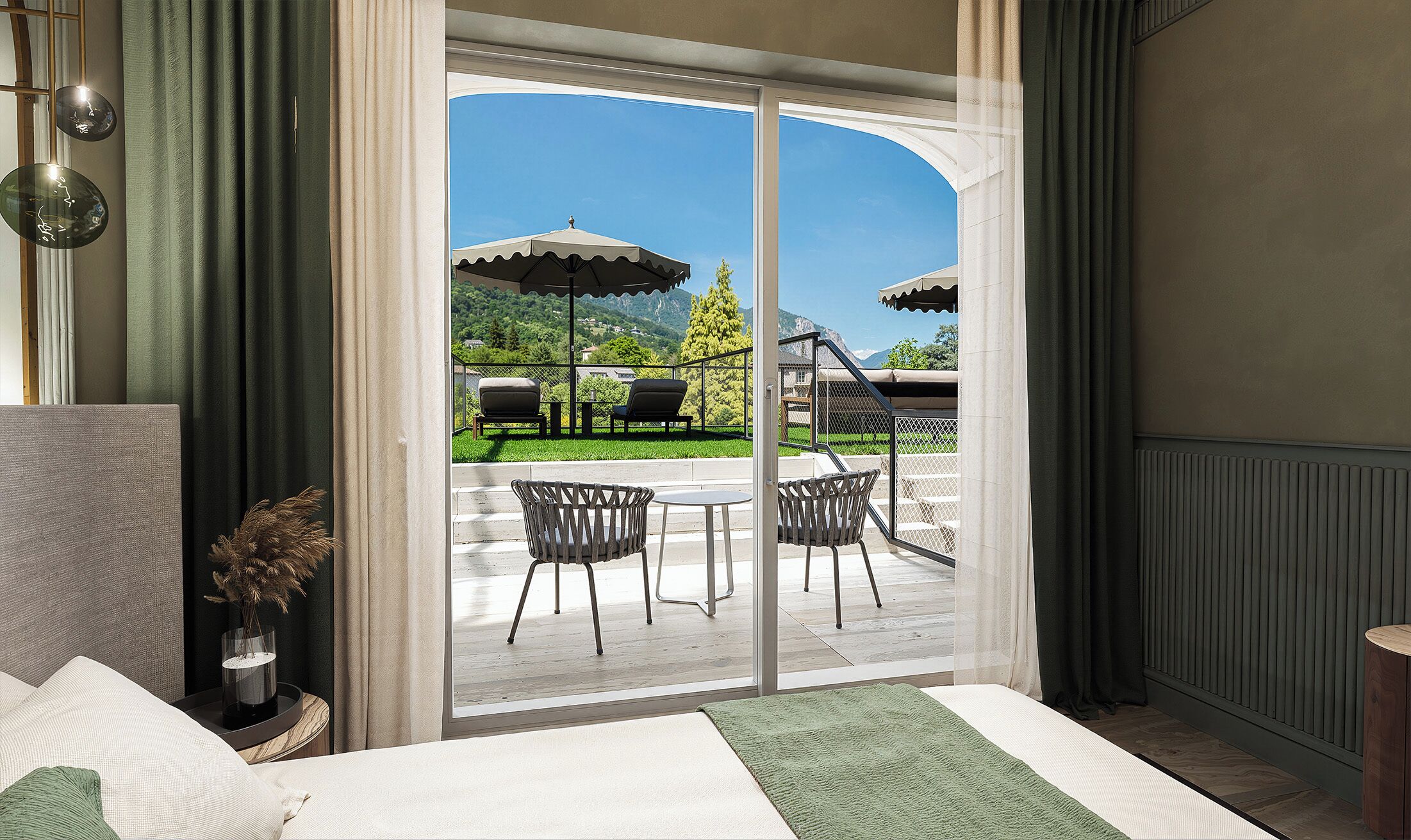 A hotel room with a sliding glass door leading to an outdoor patio with chairs and umbrellas.