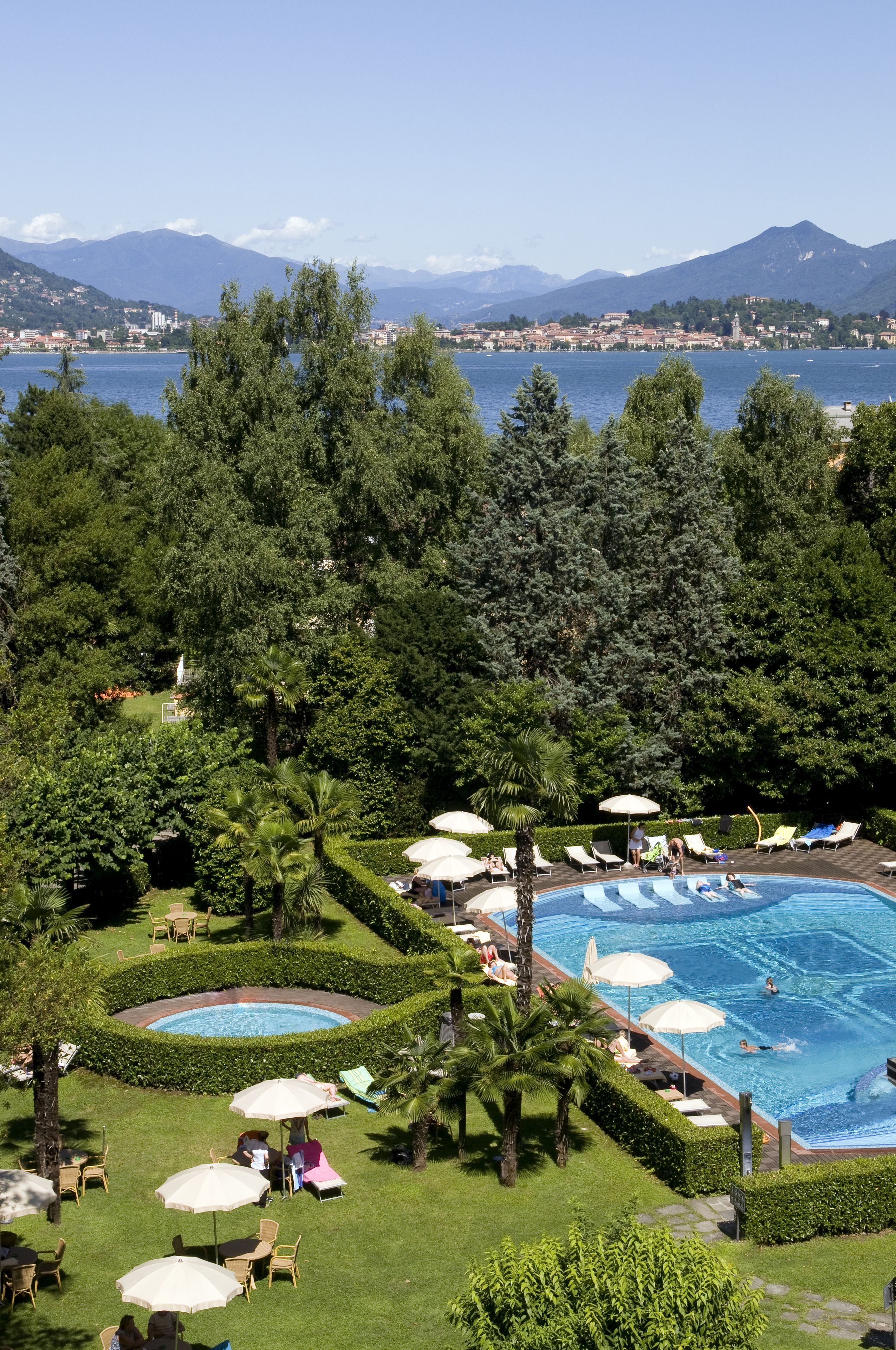 seasonal outdoor pool, pool umbrellas, pool loungers