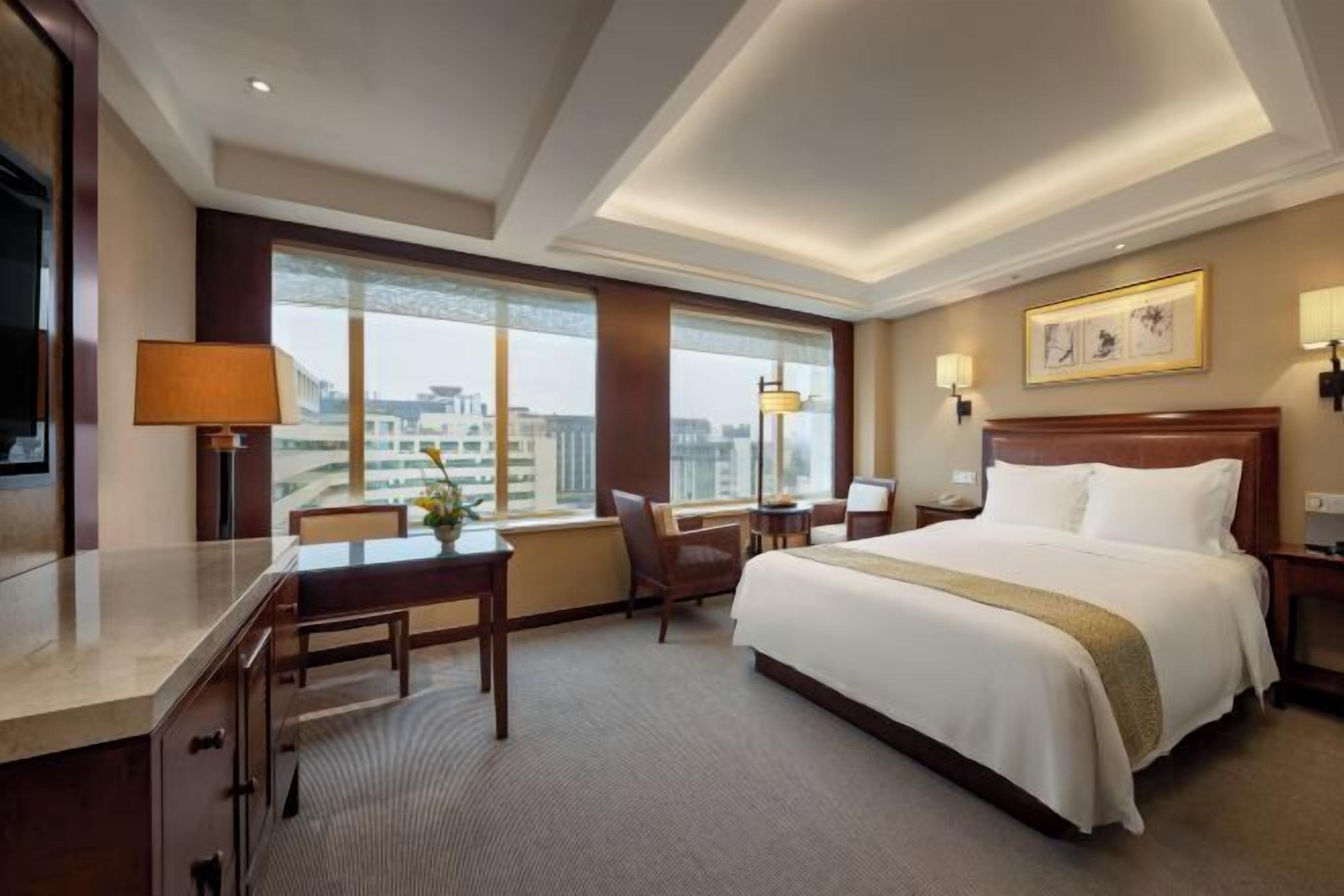 Luxe beddengoed, bedden met traagschuimmatrassen, een minibar