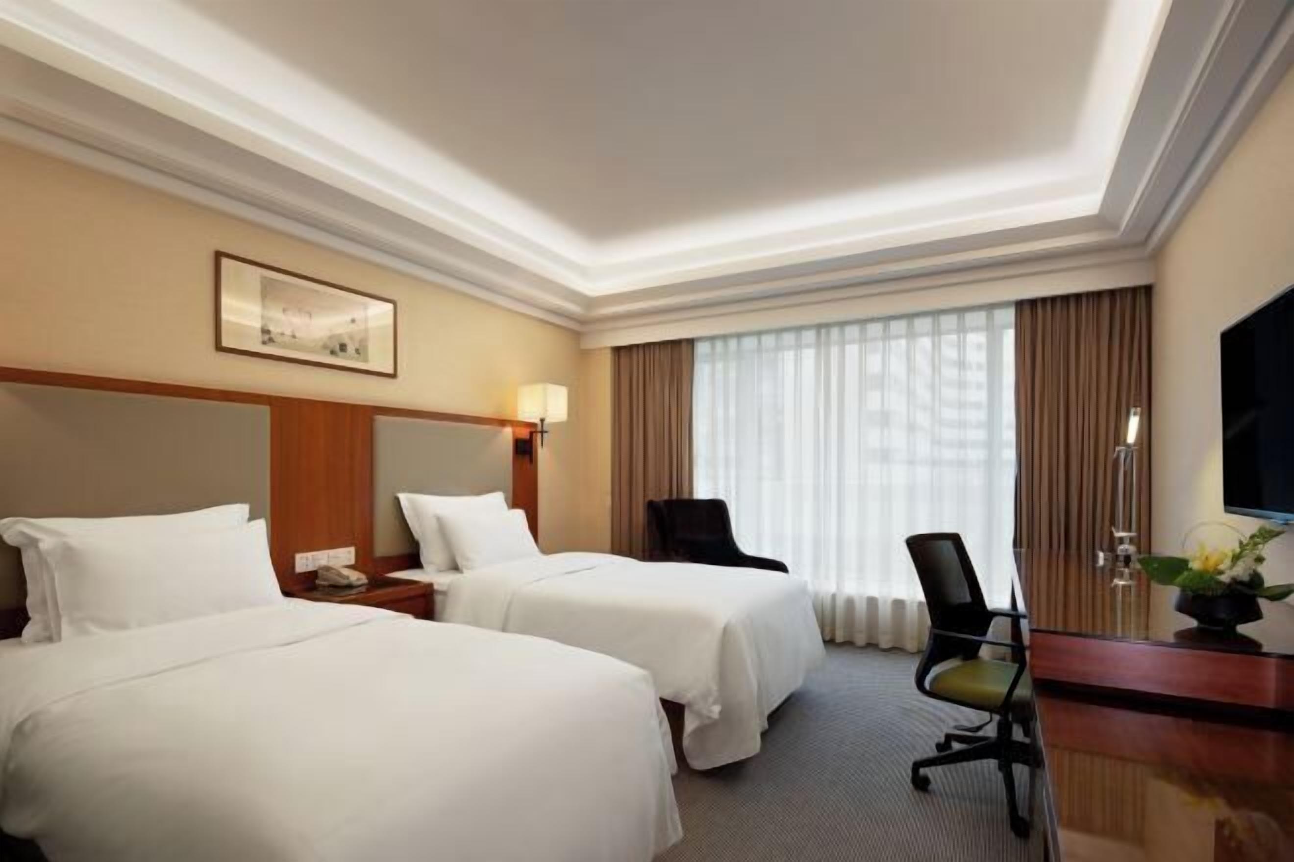 Luxe beddengoed, bedden met traagschuimmatrassen, een minibar