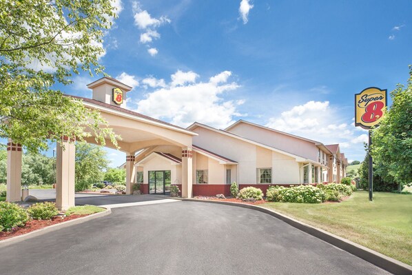 Classic hotel with a symmetrical facade and beautifully maintained grounds.