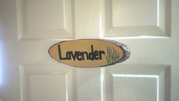 A door with a wooden sign that reads "Lavender."