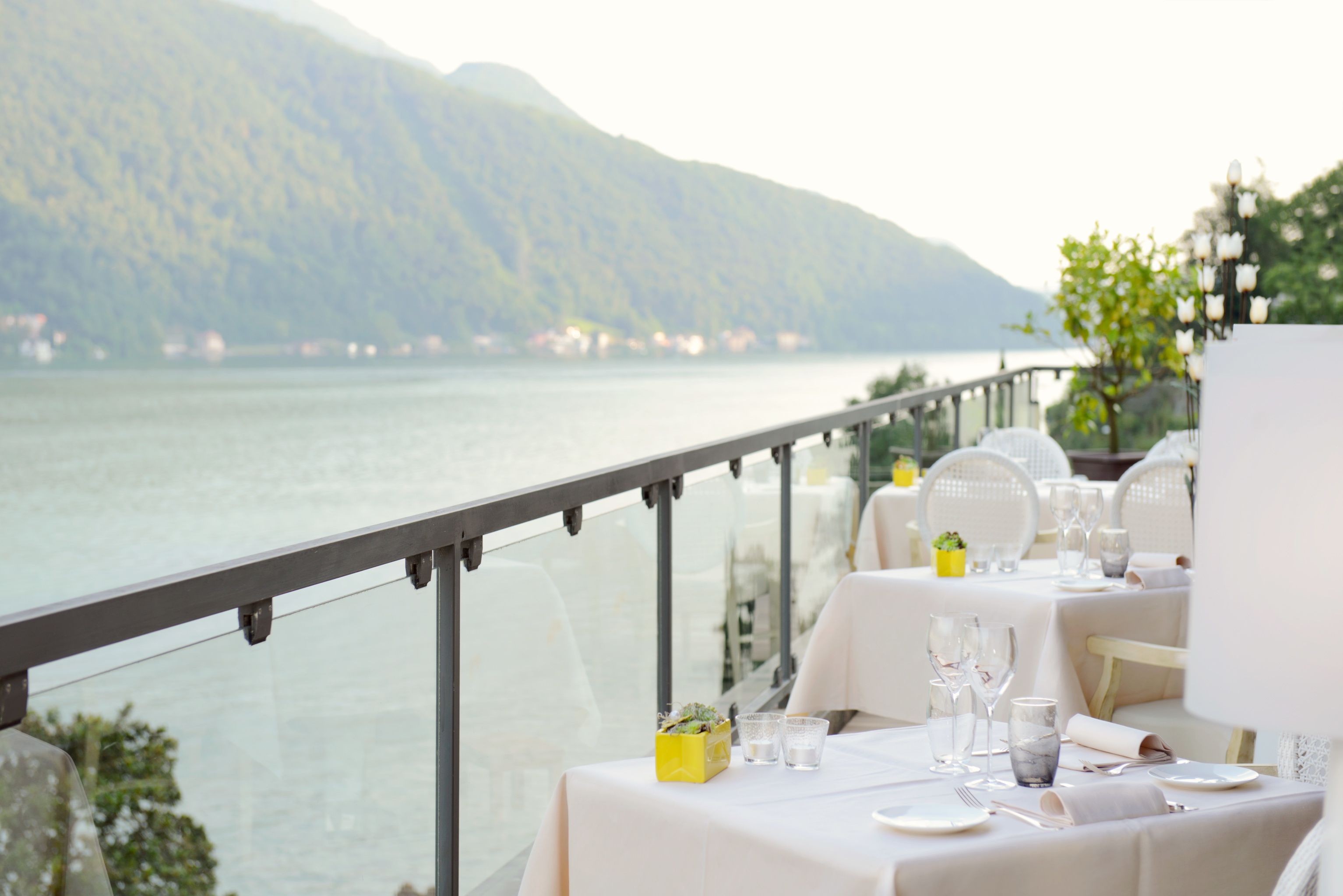 A table set for dining with a mountain view in the background.