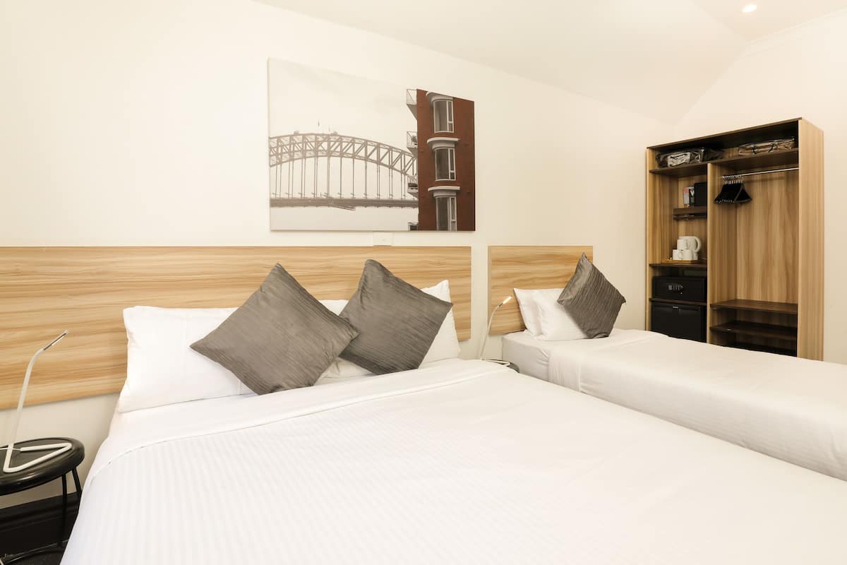 triple room with shared bathroom  | in-room safe, desk, free wifi, bed sheets