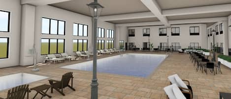 Una piscina techada, sillones reclinables de piscina