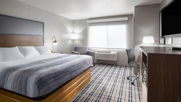 Quarto, 1 cama King, para não fumantes | Individualmente decorados, individualmente mobiliados, escrivaninha