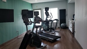 A gym with treadmills, stationary bikes, and dumbbells. - Holiday Inn Express & Suites Enterprise by IHG (Enterprise)