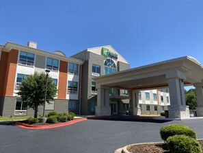 A Holiday Inn Express hotel with a covered entrance, multiple floors, and a clear sky. - Holiday Inn Express & Suites Enterprise by IHG (Enterprise)