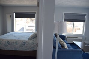 Queen Suite, Deck | 1 bedroom, desk, blackout drapes, iron/ironing board