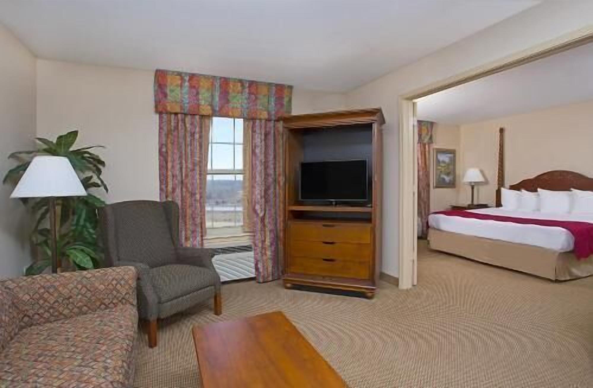 Desk, blackout drapes, iron/ironing board, rollaway beds