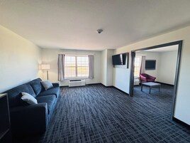 Suite, 1 King Bed, Non Smoking (One-Bedroom, Track View) | Living area | TV