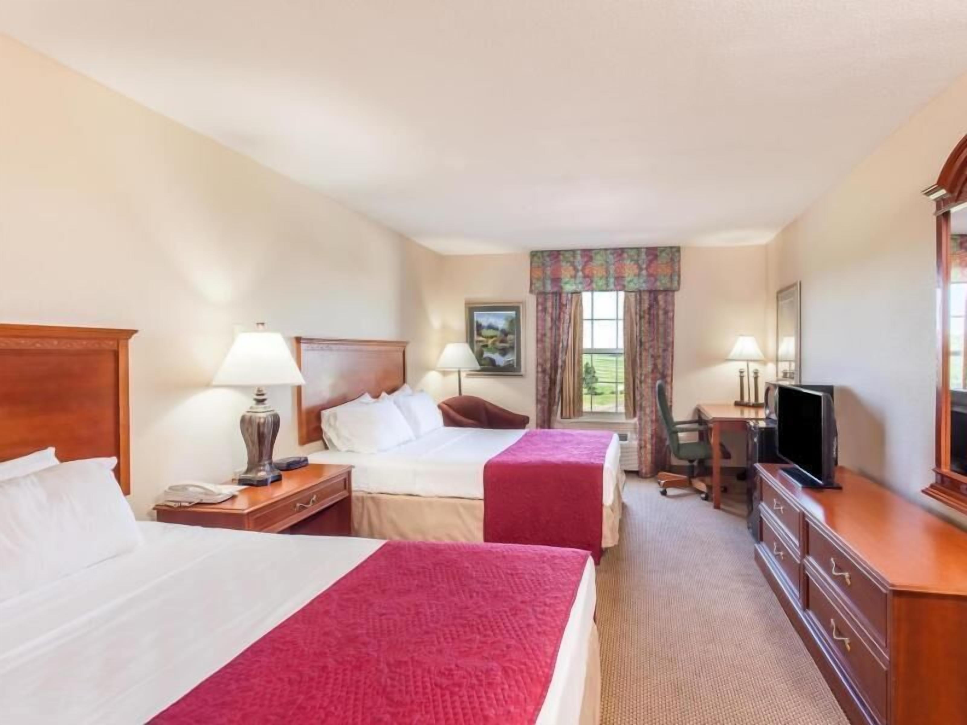 Desk, blackout drapes, iron/ironing board, rollaway beds