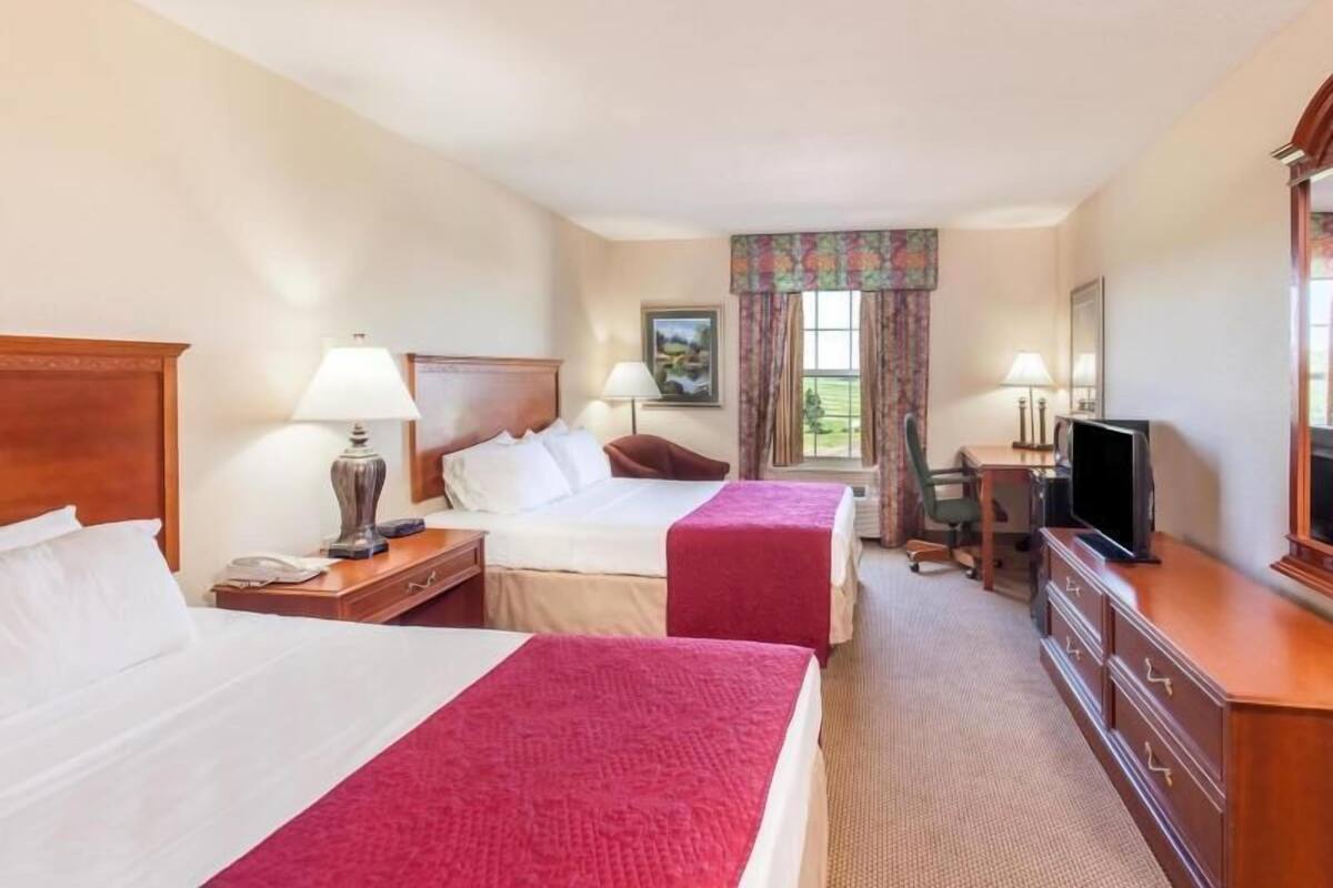 Desk, blackout drapes, iron/ironing board, rollaway beds