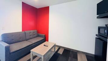 Studio Suite, 1 King Bed, Non Smoking | Desk, blackout drapes, iron/ironing board, rollaway beds