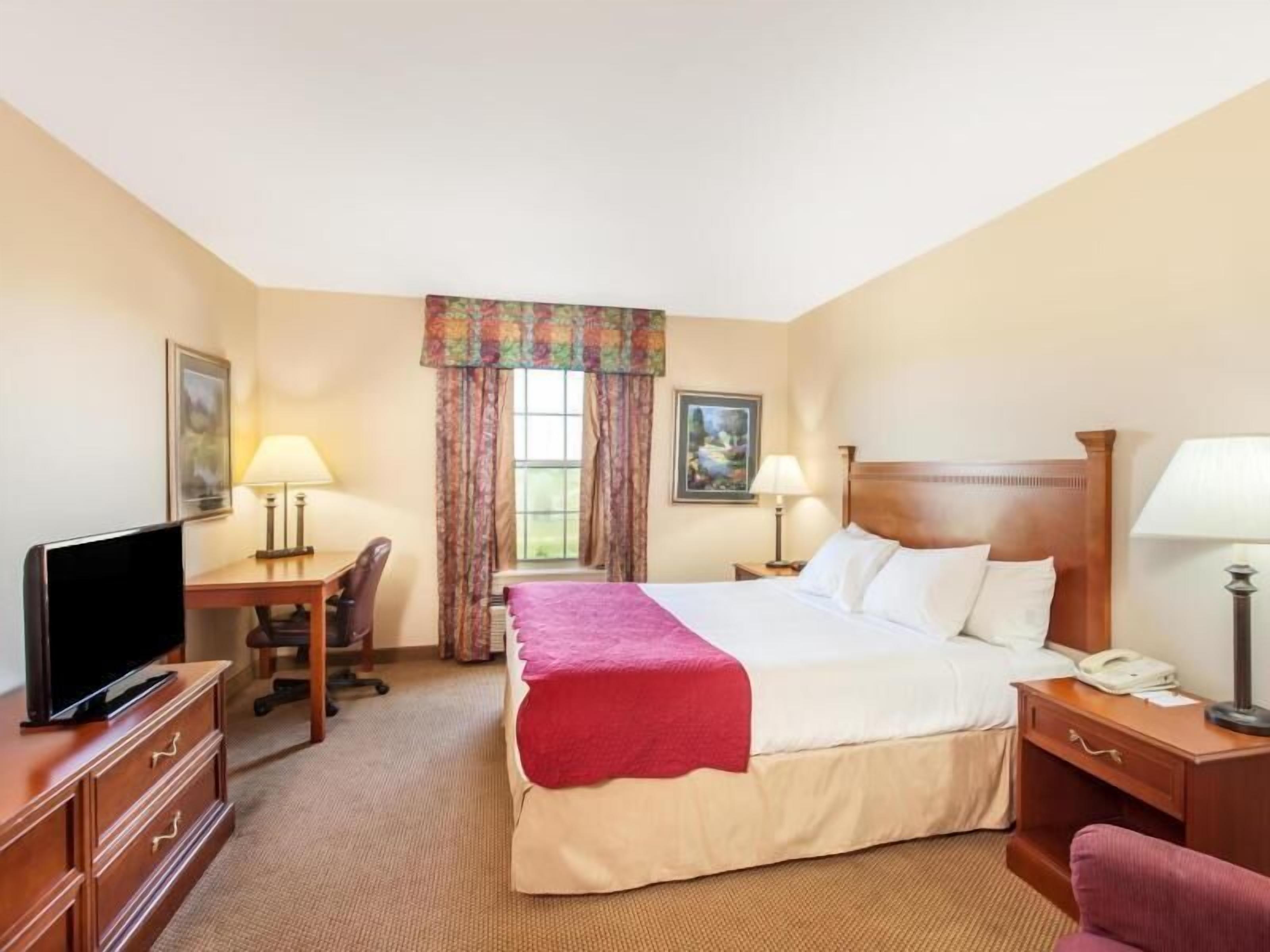 Desk, blackout drapes, iron/ironing board, rollaway beds