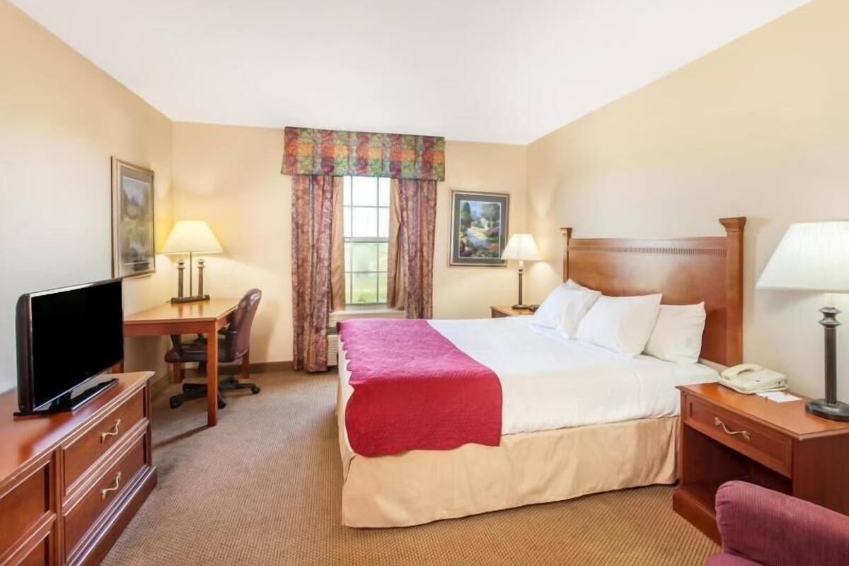 Desk, blackout drapes, iron/ironing board, rollaway beds