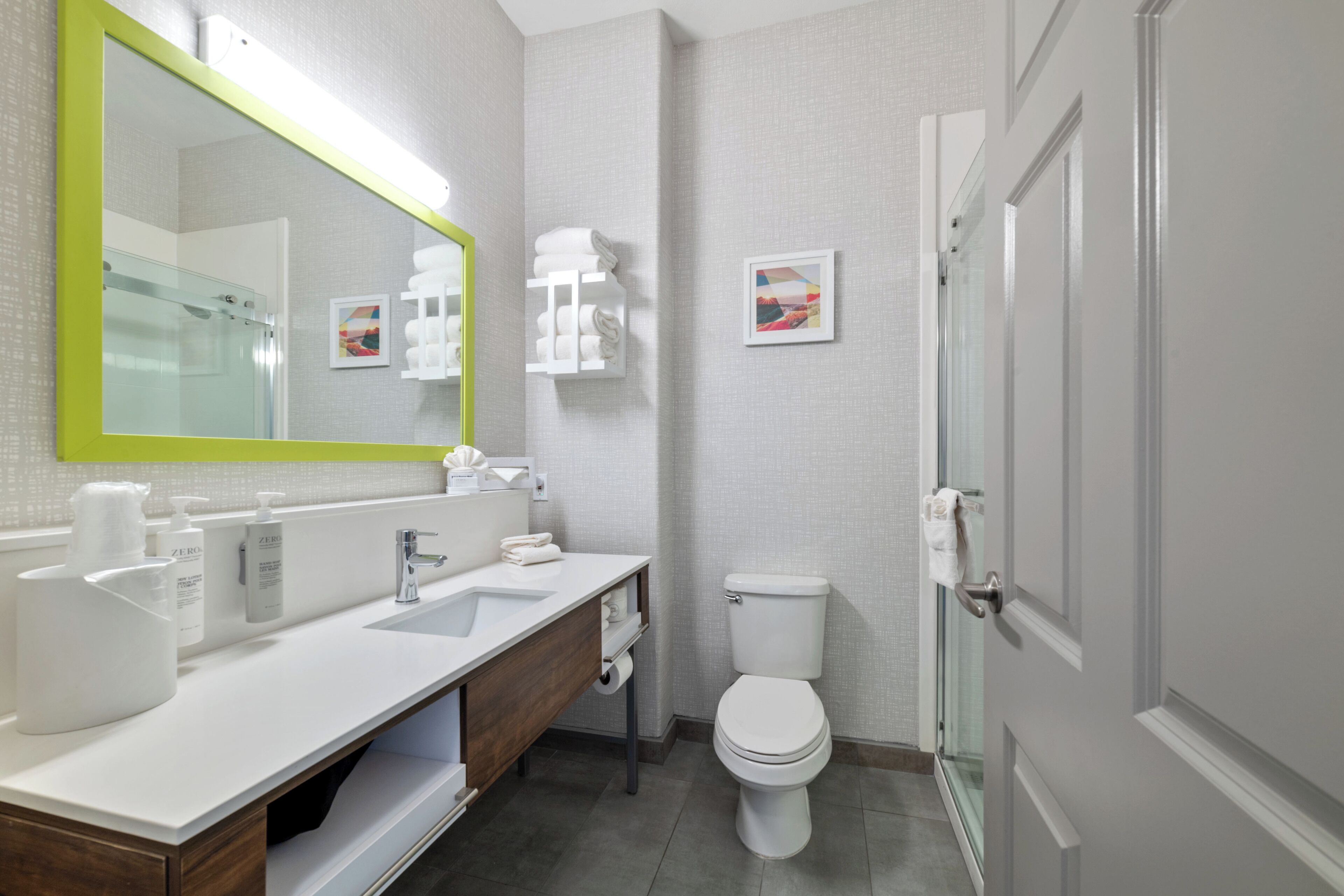 combined shower/bathtub, designer toiletries, hair dryer, towels