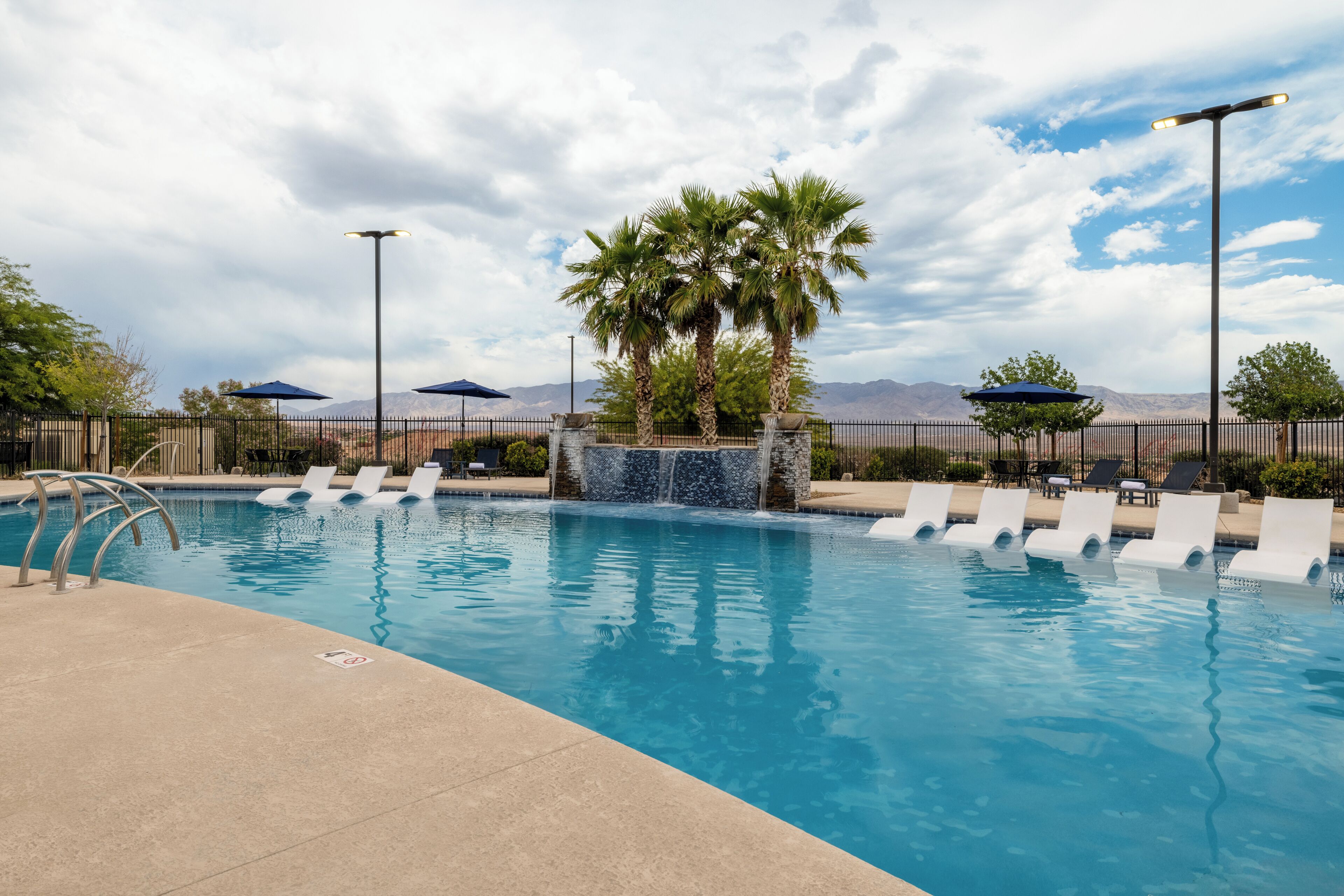 outdoor pool, open 9:00 am to 10:00 pm, pool umbrellas, pool loungers