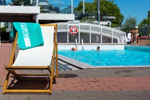 Indoor pool, seasonal outdoor pool, open 8 AM to 7 PM, pool loungers