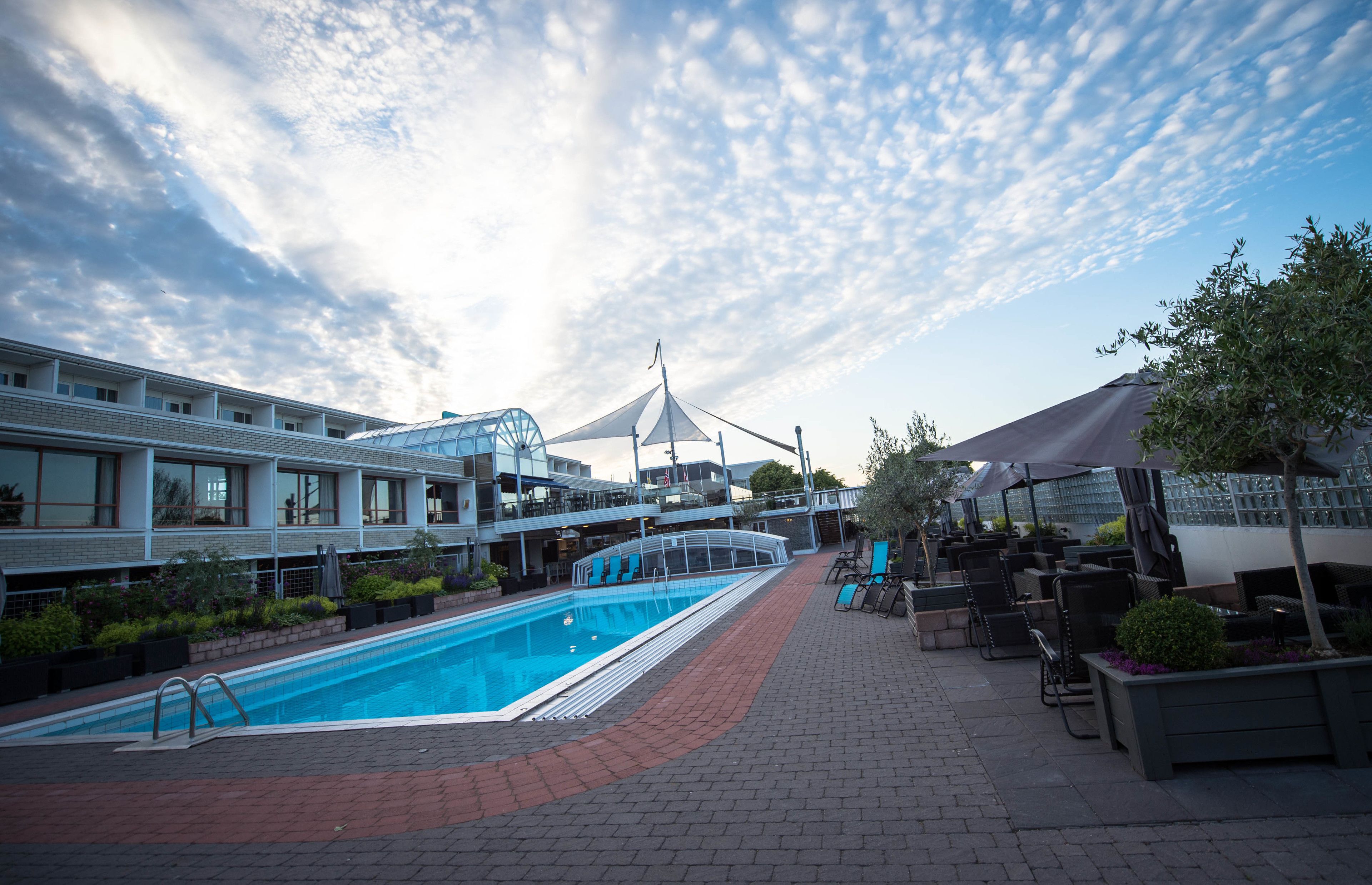 Indoor pool, seasonal outdoor pool, open 8 AM to 7 PM, pool loungers