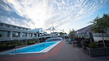 Indoor pool, seasonal outdoor pool, open 8 AM to 7 PM, pool loungers
