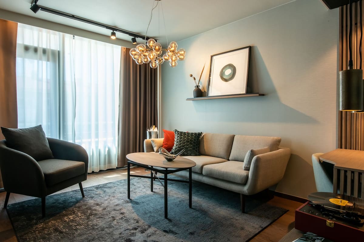 Suite, Balcony, City View | 1 bedroom, in-room safe, laptop workspace, blackout curtains