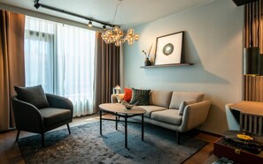 Suite, Balcony, City View | 1 bedroom, in-room safe, laptop workspace, blackout drapes