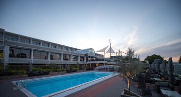 Indoor pool, seasonal outdoor pool, open 8 AM to 7 PM, sun loungers