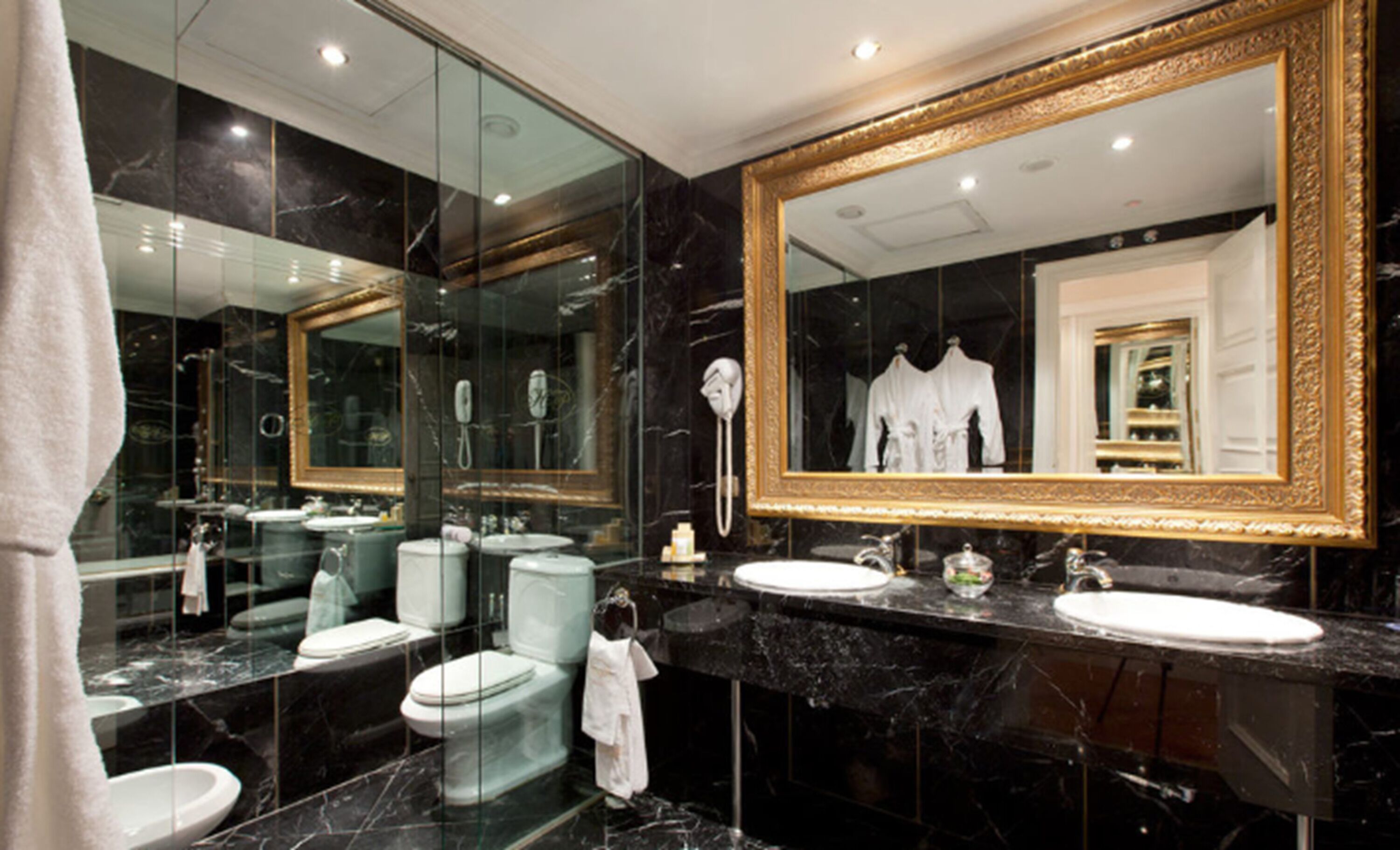 designer toiletries, hair dryer, bidet, towels