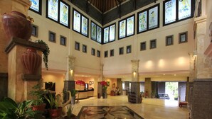 A spacious lobby with a high ceiling, large windows, and a central decorative floor pattern. - Pelangi Bali Hotel & Spa (Seminyak)
