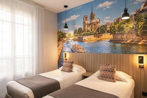 A hotel room with two beds, a mural of a cityscape, and a window with sheer curtains. - Avia Saphir Montparnasse (Paris)