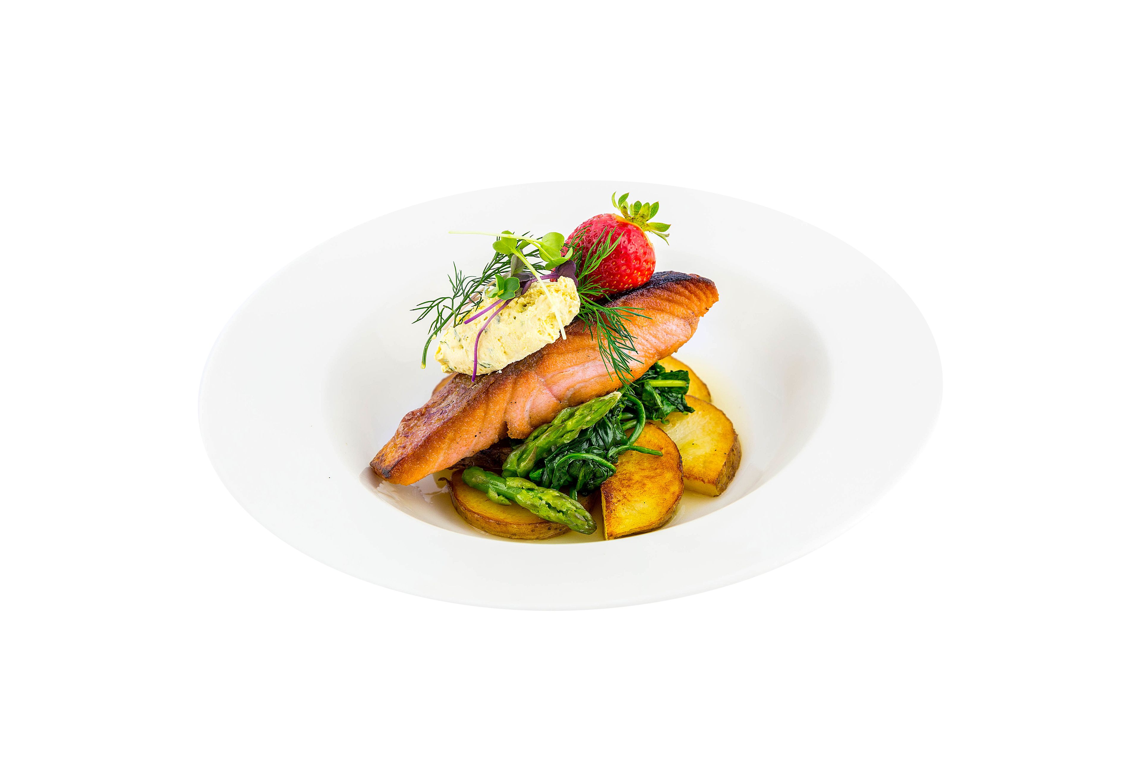 A plate of food with salmon, asparagus, potatoes, and a strawberry garnish.