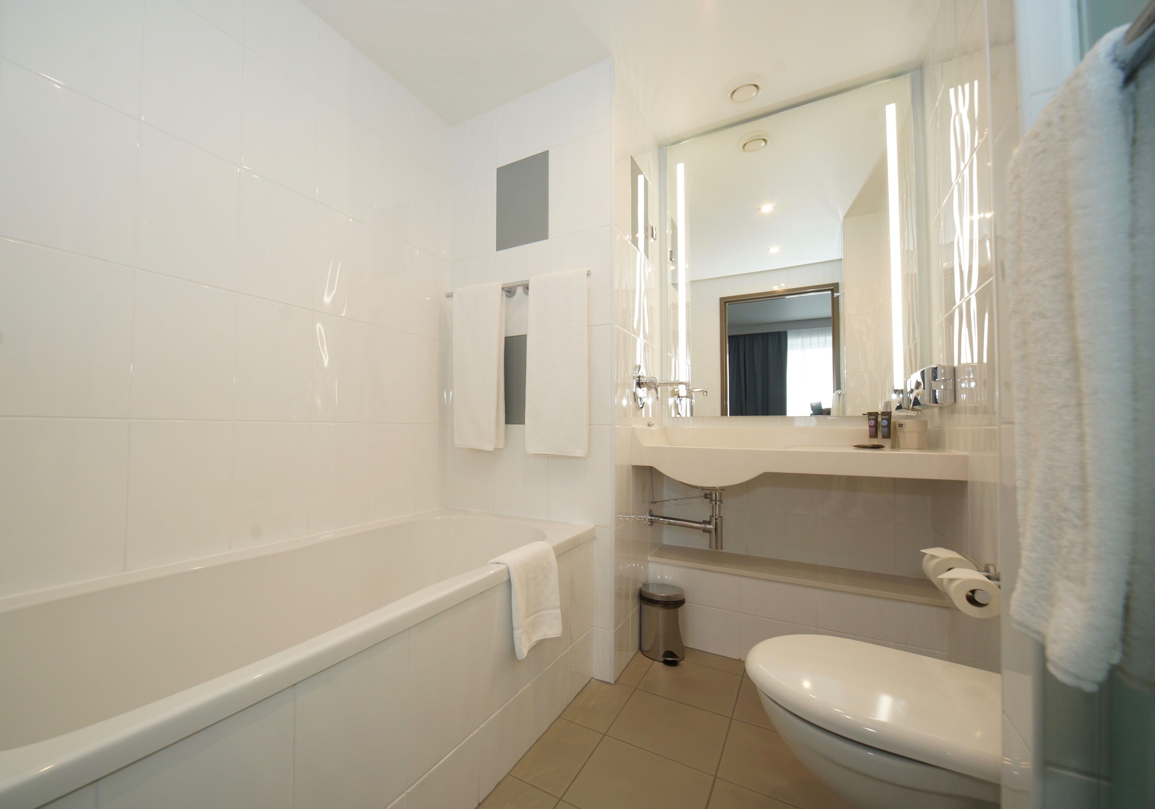 separate bathtub and shower, eco-friendly toiletries, hair dryer, towels
