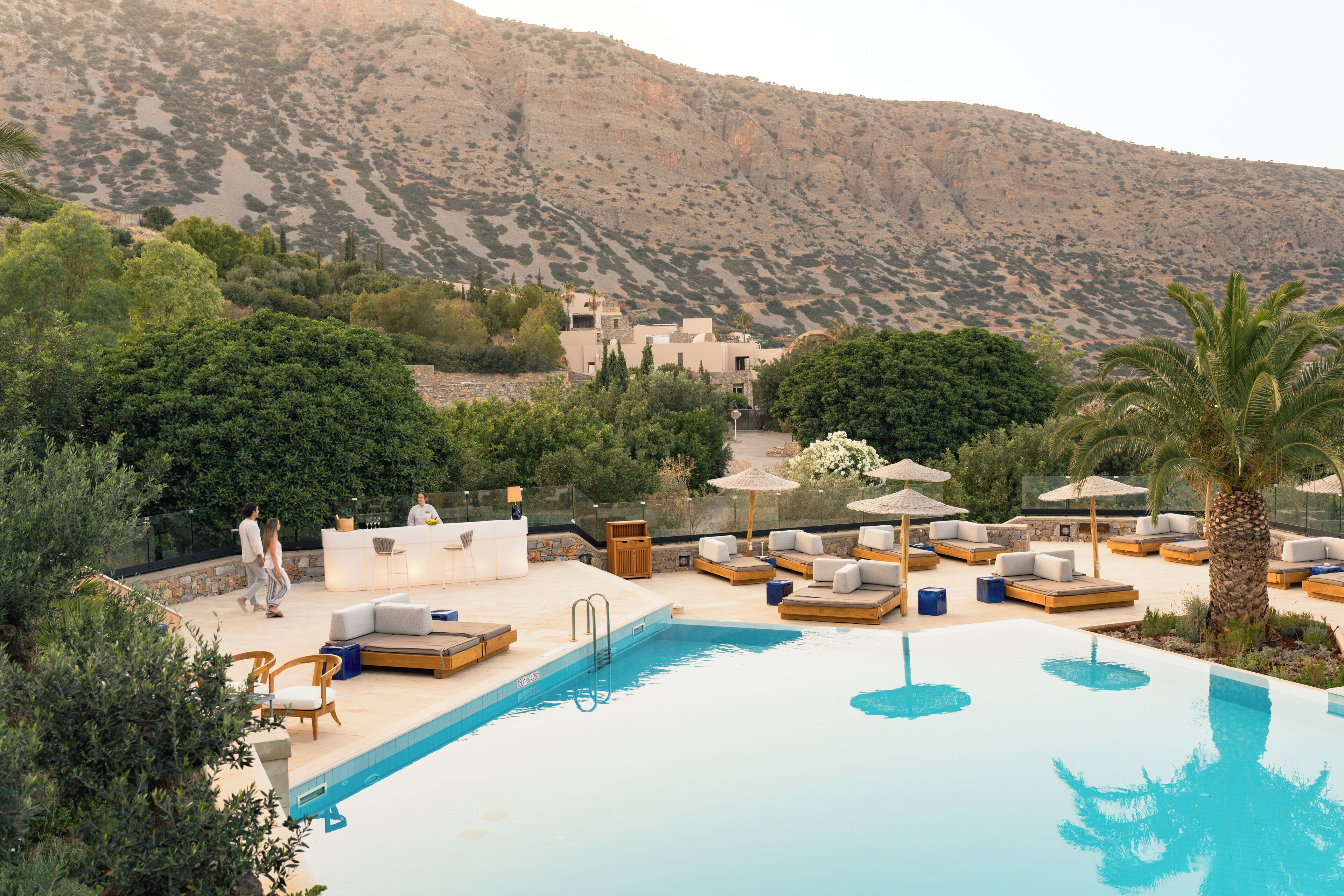 outdoor pool, open 10:00 am to 6:00 pm, pool umbrellas, pool loungers