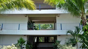 A hotel entrance with a sign reading "Hotel Villa Paras."