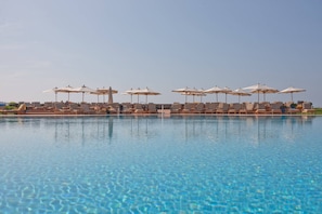 Indoor pool, outdoor pool, open 7:00 AM to 11:00 PM, pool umbrellas